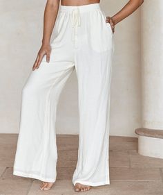 Chic Linen Wide Leg Pants With Drawstring, Chic Beach Wide Leg Pants With Drawstring, Chic Wide Leg Beach Pants With Drawstring, Summer High-waisted Wide Leg Pants With Drawstring, Bohemian White Bottoms For Loungewear, Chic Summer Bottoms With Drawstring Tie, White Bohemian Bottoms With Drawstring, Chic White Bottoms With Drawstring, Chic White Drawstring Bottoms