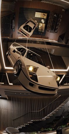 a white sports car suspended from the ceiling