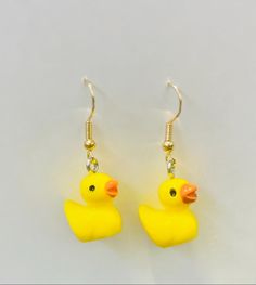 Duck earrings NEW ADDITION!! Rubber Ducky, you're the one! The cutest new addition to the shop. These fun earrings are sure to put a smile on anyone's face! Order now, before they're gone! A perfect gift for someone special! Duck Earrings, Duck Crafts, You're The One, Rubber Ducky, Fun Earrings, The Cutest, Jewelry Earrings Dangle, Etsy Earrings, The One