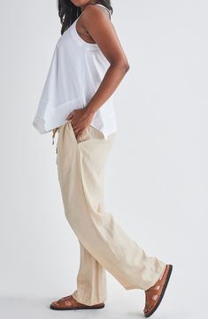 A bump-friendly smocked waist adds to the everyday comfort of wide-leg pants made from lightweight and breathable linen. 29" inseam; 20" leg opening; 12 1/2" front rise; 13" back rise Smocked waist with drawstring Side-seam pockets 100% linen Machine wash, tumble dry Imported Casual Summer Bottoms For Relaxation, White Linen Bottoms For Relaxation, Comfortable Linen Wide Leg Pants With Elastic Waistband, Summer Neutral Bottoms For Daywear, Beige Relaxed Fit Harem Pants For Loungewear, Summer Daywear Neutral Bottoms, Neutral Summer Daywear Bottoms, Relaxation Linen Bottoms With Elastic Waistband, Relaxed Linen Wide Leg Pants For Daywear