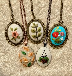 Hand-embroidered Pendant Necklaces  Another round of the beautiful, intricately-detailed hand-embroidered necklaces made by shop member, Amy C. These necklaces are such timeless accents to add to your outfits and make excellent gifts. Bohemian Necklaces With Motifs As Gift, Bohemian Necklaces With Motifs For Gift, Elegant Necklaces With Motifs For Gifts, Artisan Embroidered Jewelry For Gift, Traditional Embroidered Jewelry For Gifts, Bohemian Embroidered Pendant Necklace, Bohemian Embroidered Beaded Necklaces As Gift, Bohemian Embroidered Necklace For Gift, Traditional Embroidered Necklace For Gift