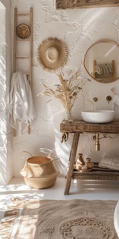 a bathroom with white walls and wood accents, including a wooden bench in the middle