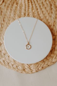 "Dainty, minimalistic, gold filled necklace that represents so much more. Encased in a small gold filled bezel is a REAL mustard seed. Serving as a meaningful reminder to have faith in Christ. Each necklace is packaged in a white box and comes with a keepsake card. Minimal in design, but packed full of meaning. Perfect for every day wear. Featuring a 16\" chain. These necklaces are 14k gold filled, which means they are NOT plated. They will not change colors on you or turn your skin green like p Minimalist Birth Flower Charm Necklace With Initial Pendant, Minimalist Initial Pendant Charm Necklace With Birth Flower, Minimalist Birth Flower Initial Pendant Charm Necklace, Minimalist Birth Flower Initial Pendant Necklace, Minimalist Jewelry With Birth Flower Initial Pendant, Minimalist Birth Flower Initial Pendant Jewelry, Minimalist 14k Gold Filled Birth Flower Jewelry, Everyday 14k Gold Filled Birth Flower Necklaces, 14k Gold Filled Birth Flower Necklaces