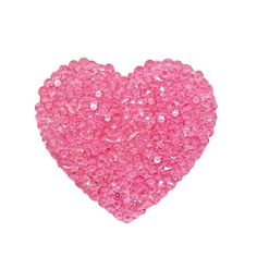 a pink heart made out of small beads