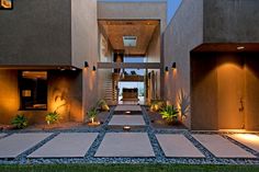 Luxury LA modern home exterior with native plant landscaping, gravel & paving stones. Construction Architecture, Concrete Pavers