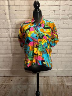 Colourful fun 1990's lightweight button up top. Womens medium  Shoulder to shoulder 15" Armpit to armpit 17.5" Length 21" Multicolor Collared Hawaiian Shirt For Spring, Spring Multicolor Collared Hawaiian Shirt, Multicolor Retro Print Button-up Top, Multicolor Collared Camp Shirt For Spring, Spring Multicolor Collared Camp Shirt, Retro Multicolor Print Tops For Beach, Retro Multicolor Print Beach Tops, Fun Multicolor Cotton Hawaiian Shirt, Retro Button-up Beach Top