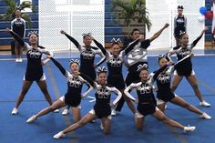 a group of cheerleaders posing for a photo