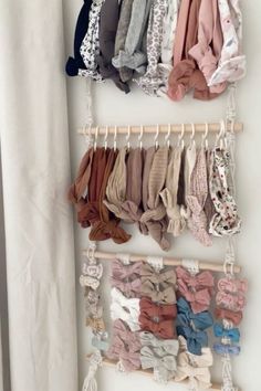 the baby's bow ties are hanging on the wall