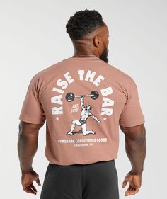 RAISE THE BAR Kill your reps in the gym & raise the bar on your training in this graphic tee. • Authentic lifting graphic• Premium heavyweight fabric SIZE & FIT• Oversized fit• Model is 5'9 and wears size L MATERIALS & CARE• 100% Cotton• 220gsm, heavyweight fabric SKU: A4A9D-KBSW Get inspired amazing T-shirt designs that make your outfit pop. Whether you’re looking for customizable shirts, this board has something for everyone. Gym Tshirt Design, Gym Graphic Tees, Sports Tshirt Designs, Bodybuilding T Shirts, Gym Tees, Raise The Bar, Gym Hoodie, Gym Fits, Shirt Print Design