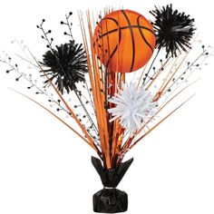 a basketball and flowers in a vase on a white background for halloween decorations or centerpieces