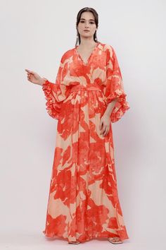 Saffron dress with floral prints, ruffle detailing and kimono sleeves. Comes with belt.
Components: 2
Pattern: Printed
Type Of Work: Floral
Neckline: V neck
Sleeve Type: Kimono
Fabric: Crepe
Color: Orange
Other Details: 
Ruffle detailing
Tie-up belt
Occasion: Party - Aza Fashions Long Floral Patterned Kaftan, Bohemian Floral Print Floor-length Kaftan, Tropical V-neck Floral Print Kaftan, Multicolor Floral Print Floor-length Kaftan, Silk Floral Print Maxi-length Kimono, Maxi Dress Pattern, Kimono Fabric, Kimono Sleeve, Feminine Dress