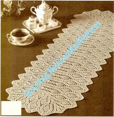 an old crocheted table runner with the word'welcome'written on it