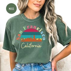 San Francisco California Comfort Colors T-Shirt, San Francisco Vacation Gift Tee, San Francisco Shirt, San Francisco California Travel Shirt. Orders are processed within 24 hours and shipped out within 2 to 5 business days. What you receive: Comfort Colors Adult Unisex Crewneck T-shirt Color: Pepper Ivory Blue Spruce Moss Blue Jean Yam Orchid Berry Watermelon Sizes: Unisex adult sizing use size chart as a guide. These shirts are fitted and run true to size. If you prefer a loose fit go one size Retro Green Top With Letter Print, Retro Green Tops With Text Print, Multicolor Soft-washed Graphic Tee, Retro Green Slogan Top, Soft-washed Multicolor Graphic Tee, Multicolor Relaxed Fit Soft-washed T-shirt, Green Soft-washed Graphic Tee Shirt, San Francisco Vacation, Travel Shirt