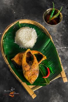 some food is on a green plate with rice