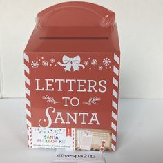 a red box with letters to santa written on it