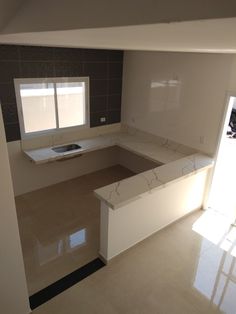 an empty kitchen is shown with no one in the room or furnishings on the counter