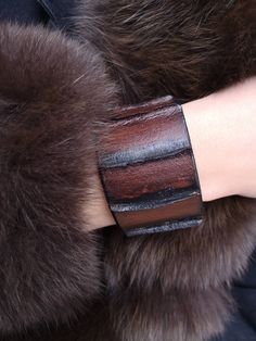 This bracelet is made of first class leather and is equipped with metal button.  The style of this bracelet is dateless and is suitable for every occasion. SIZE INFORMATION; This bracelet is 16.5 cm Leather Wristbands, Leather Cuffs Bracelet, First Class, Leather Cuffs, Metal Buttons, Leather Fashion, Cuff Bracelet, Cuff Bracelets, Leather Bracelet