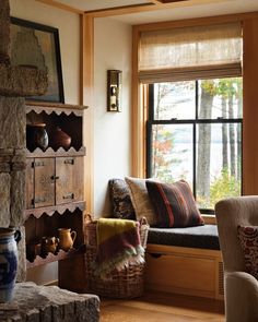 a living room filled with furniture next to a window