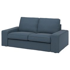 a blue couch sitting on top of a white floor