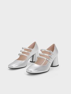 Silver Claudie Metallic Buckled Mary Janes Modern Silver Heels With Buckle Closure, Metallic Heels With Buckle Closure For Spring, Spring Metallic Heels With Buckle Closure, Silver Mary Jane Heels For Spring, Silver Mary Jane Heels For Party, Spring Silver Mary Jane Heels, Silver Mary Jane Heels For Evening, Marry Jane, Faux Leather Heels