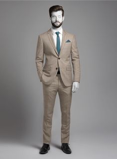 A refined style that allows you to move with ease and grace is embodied in our Napolean Genova Stripe Dark Beige Wool Suit, perfect for leaving lasting impressions at formal gatherings or corporate affairs. Custom-made from a wool blend, our suit features a stripe pattern woven into the fabric in a sophisticated beige color, adding subtle hints of understated luxury to your ensemble. Invest in this charming epitome of class and set new standards with modern fashion.  Look Includes    Napolean Genova Stripe Dark Beige Wool  Fabric  Two Button Jacket Style  Notch Lapel   Horn Brown  Buttons  Single Vent  Three Cuff Buttons  Two Welted Back Pockets on Trousers   Click 'Customize Now' to modify the look if needed.   Lining: Viscose, Dry Clean, Pants can be lightly washed. Elegant Custom Fit Three-piece Suit With Welt Pockets, Elegant Beige Formal Blazer, Elegant Slim Fit Three-piece Suit For Formal Occasions, Timeless Beige Blazer For Formal Occasions, Timeless Beige Business Suit, Beige Slim Fit Blazer For Formal Occasions, Classic Beige Semi-formal Suits, Beige Three-piece Suit For Formal Events, Custom Fit Suits With Welt Pockets For Wedding