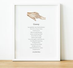 a framed print with an image of a hand and poem