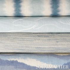 four different shades of blue and white fabric with the words schumacher on them