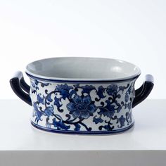 a blue and white bowl sitting on top of a counter