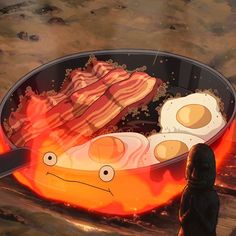 two fried eggs and bacon in a frying pan on fire with a person looking at them