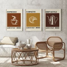 three coffee posters hanging on the wall above a table in a room with a couch and chair