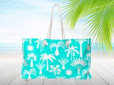 "Blue and white, Tropical palm tree print, Personalized Beach bag with rope handles. Monogram tote bag. Bridesmaid gift, Nautical tote bag, Weekender Travel bag 24\"x 13\"x 5\". It's a carry all bag, a baby bag, or a carry on bag for vacation. Personalized tote bag with a Nautical aesthetic. Free Shipping* Bridesmaid proposal gift or wedding gift. Rope handles are 27\" long and fed though gold color metal grommets. Lightweight and packable our large beach tote is perfect for your weekend at the Blue Tropical Rectangular Bag, Tropical Blue Rectangular Bag, Tropical Rectangular Bag For Beach Season, Rectangular Canvas Beach Bag With Handles, Rectangular Canvas Bag For Vacation, Rectangular Tropical Beach Bag, Tropical Rectangular Beach Bag For Travel, Vacation Tote Bag For Poolside, Rectangular Canvas Gift Bag For Beach