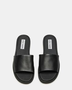 Classic Black Slides With Textured Footbed, Classic Slides With Leather Footbed, Classic Slides With Removable Insole, Classic Open Toe Slides With Rubber Sole, Classic Black Slip-on Slides, Classic Black Summer Slippers, Classic Black Flat Slides, Classic Black Slippers For Summer, Classic Flat Slides With Removable Insole