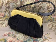 "A fantastic and unusual 1930s bag in a brown suede, with an amazing pale cream marbled lucite resin frame. The bag has gentle folded overlapping texture on both sides. The edges are leather bound, it opens up wide. Interior is a black satin with two pockets either side. Condition is excellent structurally, you will see there is a notable tear on the side and a few cracks on the strap. However the bag is very wearable, and one could have the tear on the side covered with a suede patch. Please zo Art Deco Bag, Marbled Resin, Resin Frame, Textile Bag, 30s Fashion, Bag Elegant, Frame Bag, Pretty Bags, Vintage Purse