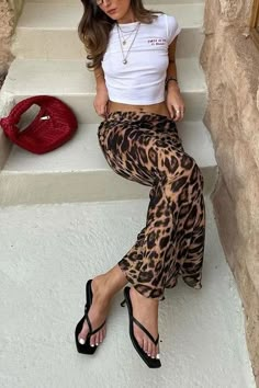 Made from a silky material that hugs you in all the right places, the Leopard Slim Fit Maxi Skirt is a mix of cute and sexy. Dress it up with a pair of kitten heels and a blazer, or dress it down with sneakers and your favorite tee! 95% satin, 5% spandex Slim Fit Low Rise Side Zipper Size Guide in Images! Brown Cow Print Skirt Outfit, Fitted Maxi Skirt, Birthday Fit, Vintage Leopard, Animal Print Skirt, Styling Inspiration, The Leopard, Hip Dress, Dress Size Chart