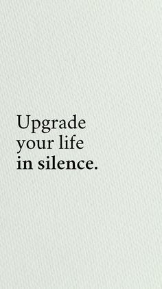 the words upgrade your life in silence are written on a white paper with black lettering