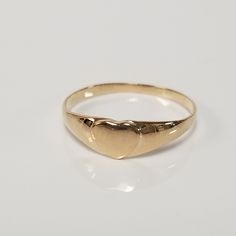 "Thanks for shopping our vintage estate store. We tend to sell well below wholesale and truly hope you enjoy all of our items. Many of the items are one of a kind, so please enjoy scrolling through the pictures and hopefully something will catch your eye. Brown spots are from camera or reflections. Estate 14k yellow gold heart baby ring. Custom made ring for our shop. Ring size: 3.25 Setting: 4mm 1/4\" Band width: 1mm Weight: .59 gram Marked 14k and it's sweet. One that you will love." Baby Ring, Baby Heart, Baby Rings, Heart Shaped Jewelry, Midi Ring, Ring Antique, Midi Rings, Gold Baby, Jewelry Lookbook