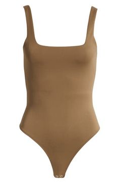 Love to layer in this shapely tank bodysuit designed with a wide straps and a modern square neckline. Square neck Sleeveless Partially lined 80% nylon, 20% elastane Dry clean or machine wash, tumble dry Imported Black Owned and Founded Modern Tank, Bodysuit Designs, Scuba Fabric, Tank Bodysuit, American Modern, Modern Square, Good American, Body Suit, Wide Straps