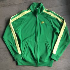 Vintage Genuine Nke. Track Sports Jacket Brazil  Size Medium  Arm pit to Arm pit 22" Top of shoulder to bottom 28" Sporty Green Track Jacket With Ribbed Cuffs, Green Sporty Track Jacket With Ribbed Cuffs, Green Athleisure Outerwear With Ribbed Cuffs, Retro Long Sleeve Outerwear For Sports Season, Sporty Green Outerwear With Ribbed Cuffs, Green Long Sleeve Track Jacket For College, Green Long Sleeve College Track Jacket, Green Varsity Track Jacket For Winter, Crew Neck Track Jacket For Winter Sports