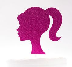 the silhouette of a woman's head is made out of pink glitter and has a ponytail