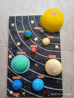 the solar system is made out of clay and has planets, stars, and sun on it