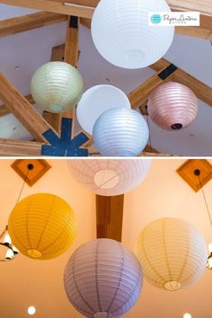 three different colored lanterns hanging from the ceiling