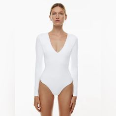 A Long Sleeved Babaton Bodysuit From Aritzia. Color Is An Off-White / Ivory / Bone Color. Size M Never Worn. Took Off Tags And Can’t Return. Body Suit Long Sleeve, Floral Bodysuit, Square Neck Bodysuit, Pink Bodysuit, V Neck Bodysuit, Bodysuit Fashion, Ribbed Bodysuit, White Bodysuit, Sleeveless Bodysuit