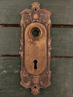 an old door with a keyhole on it