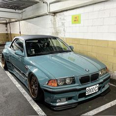 a blue car parked in a parking space