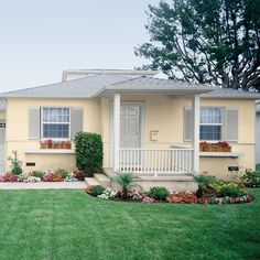 a house with flowers in front of it and the words don't do my belin exterior paint