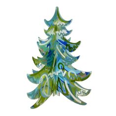 a glass christmas tree with blue and green designs on it's sides, standing upright against a white background