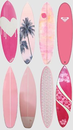 six surfboards with pink and white designs on them