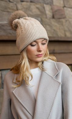 Indulge yourself in supreme warmth with the iconic Cable-Knit Cashmere Beanie, featuring a classic interlocking cable-knit pattern accentuated with a plush fox fur pom-pom. Crafted with the finest cashmere and inspired by the thick, layered design of Atlantic-crossing fisherman sweaters, this beanie offers rich thickness and exceptional softness, bringing cozy warmth to even the chilliest days. Uncompromising Quality: Made from the finest cashmere for superior softness. Effortless Elegance: Elev Fisherman Sweaters, Cashmere Winter Scarf, Silk Tee, Cashmere Pants, Silk Blouses, Cashmere Socks, Cashmere Beanie, Cashmere Accessories, Fisherman Sweater