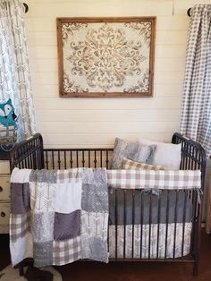 a baby crib in front of a window with curtains