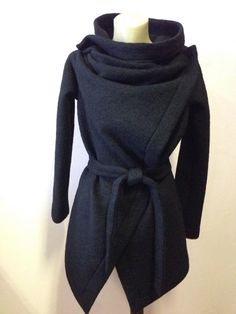 This is a new wool wrap cardigan.Looking fabulous either with the belt,wish is from the same material or without it.It will best fit for size S/M The colour is black .It is 100%wool and is really warm,would recommend dry cleaning for washing it.It does not have lining,it is like a big cosy shawl with sleeves.Has two discret buttons.An outstanding piese of clothing for the upcoming season.SIZE CHARTSIZE S - US 6, UK 8, EU 36bust: bust around 34.5”/90cmWaist: waist around 27.5”/70cmHips: hips arou Chic Oversized Wrap Outerwear, Oversized Chic Wrap Outerwear, Belted Wrap Outerwear For Fall, Wool Wrap Outerwear For Fall, Fall Wrap-style Belted Outerwear, Fall Belted Wrap Outerwear, Fitted Wrap Outerwear For Winter, Fitted Wrap Winter Outerwear, Oversized Wrap Outerwear For Winter